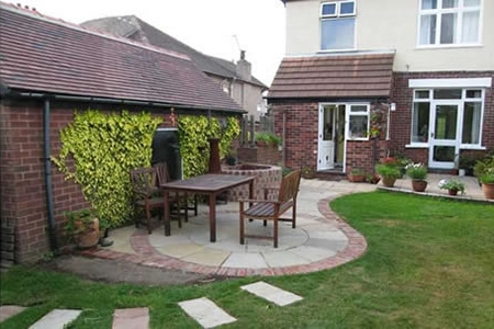 Wendy Guilder’s garden after the circular patio was built.