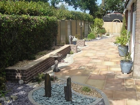 The Humpage courtyard after paving, planting and pots.